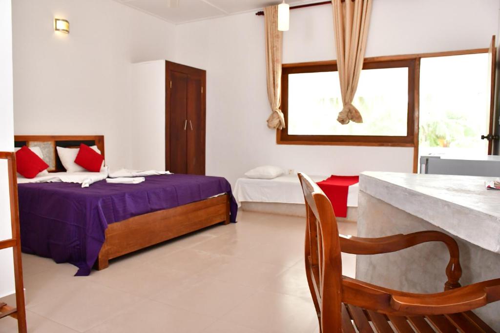 Postel nebo postele na pokoji v ubytování Sea Way Hotel