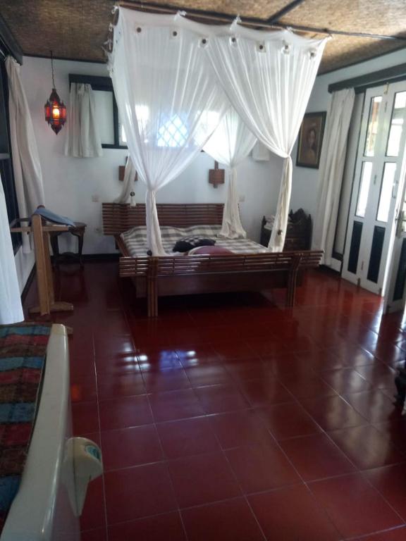 Postel nebo postele na pokoji v ubytování Adams homestay