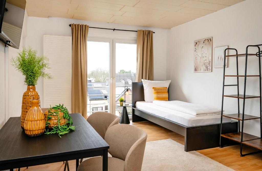 En eller flere senge i et værelse på Gemütliche 2 Zimmerwohnung für 4