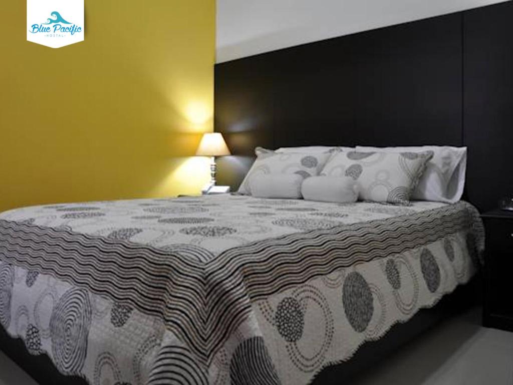 Postel nebo postele na pokoji v ubytování Hostal Blue Pacific