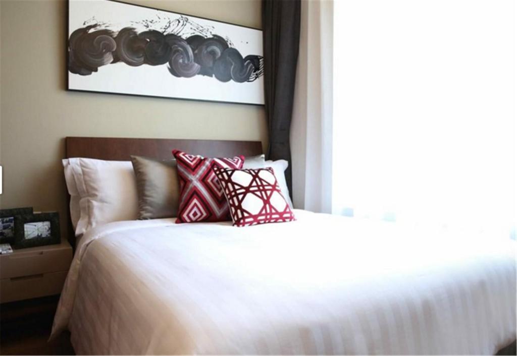 Ein Bett oder Betten in einem Zimmer der Unterkunft Green Court Place Jingqiao Middle Ring Shanghai