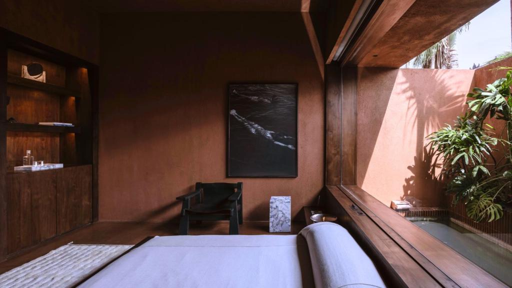 Postel nebo postele na pokoji v ubytování Further Hotel