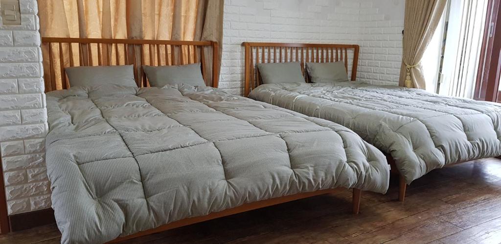 Postel nebo postele na pokoji v ubytování Jun House
