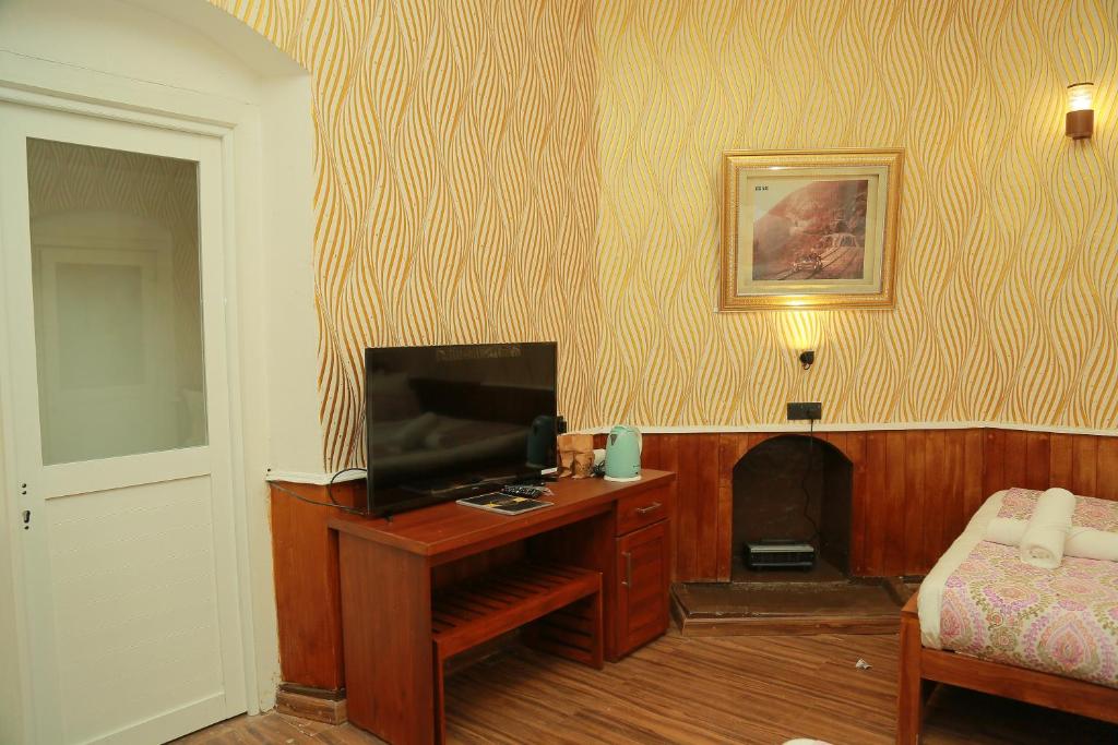 TV a/nebo společenská místnost v ubytování Gregory Lake View Bungalow