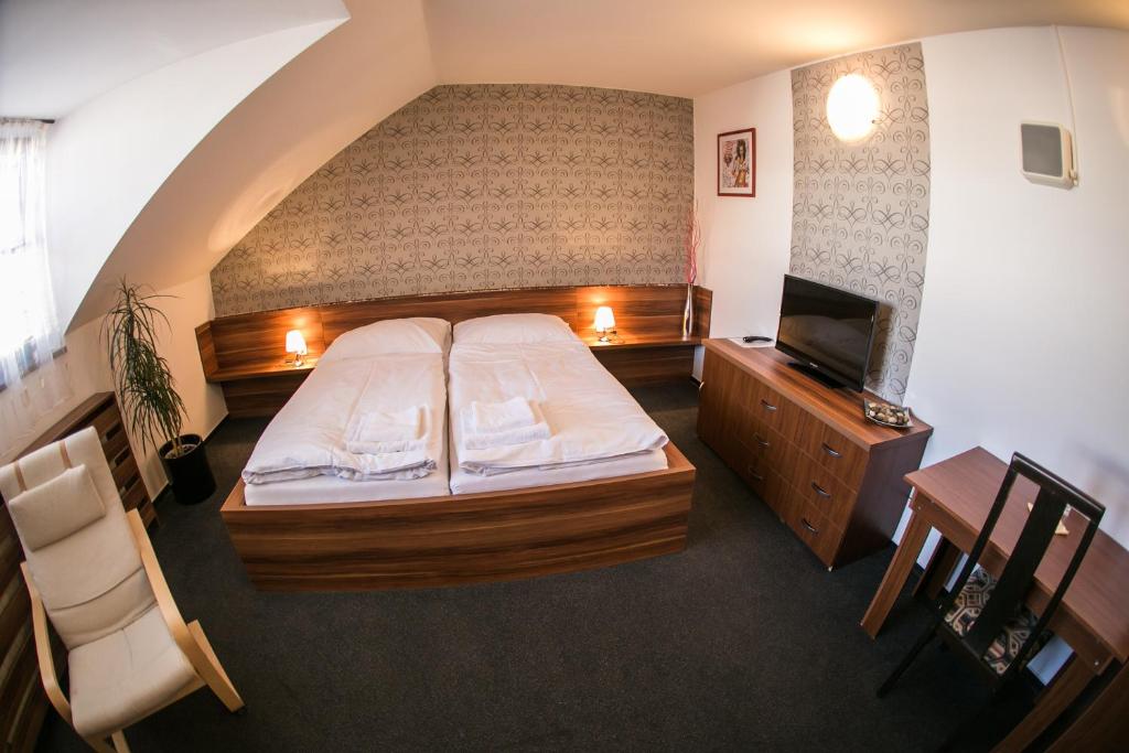 Postel nebo postele na pokoji v ubytování Hotel ROSE Břeclav