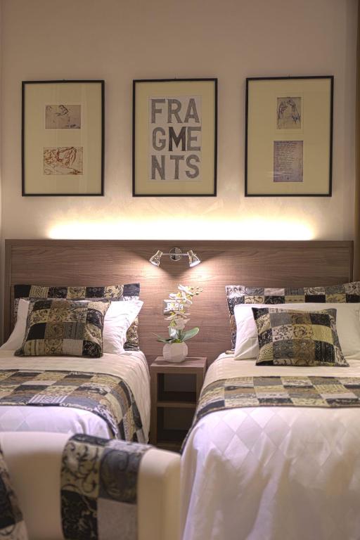 Postel nebo postele na pokoji v ubytování Hotel Marcantonio