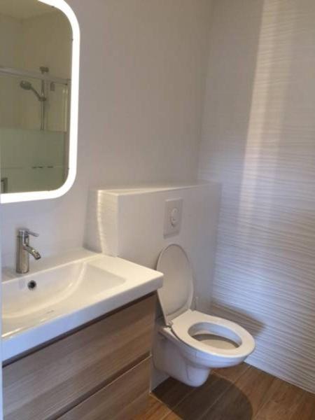 a white bathroom with a sink and a toilet at Villa MA&VA in Lacanau-Océan