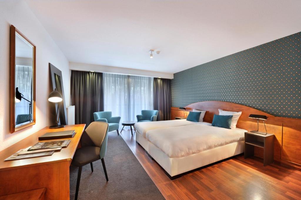 Postel nebo postele na pokoji v ubytování Van der Valk Hotel Nazareth-Gent