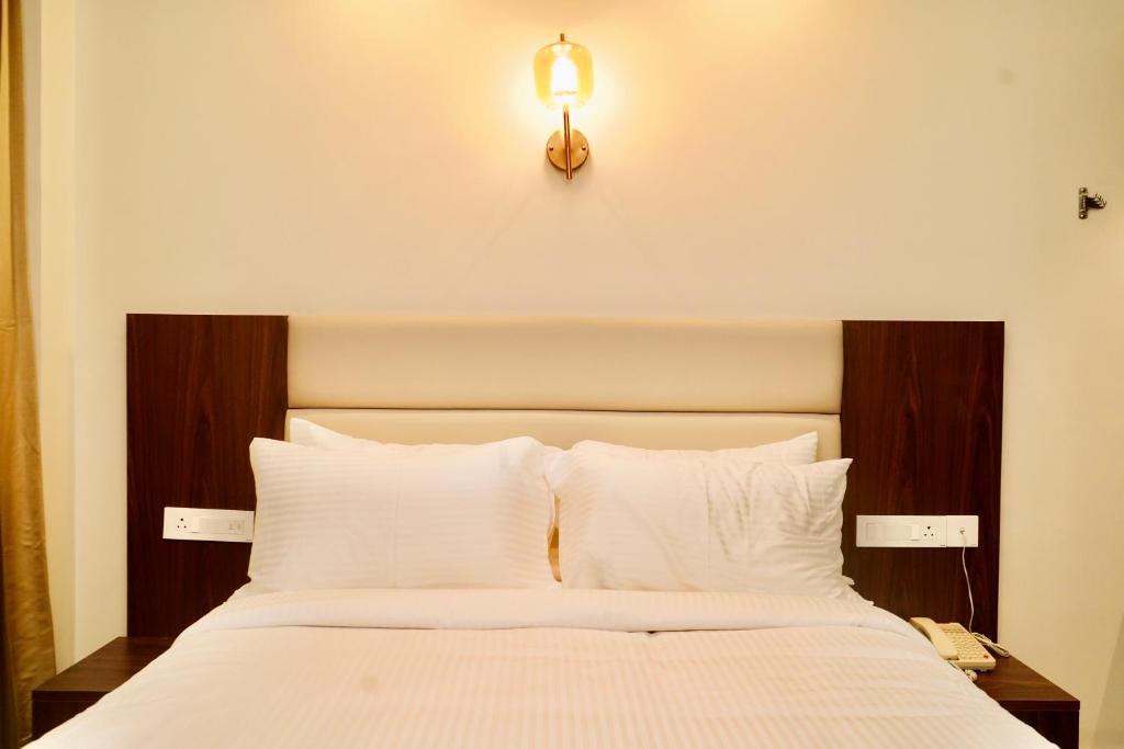 Postel nebo postele na pokoji v ubytování Jaag Hotel
