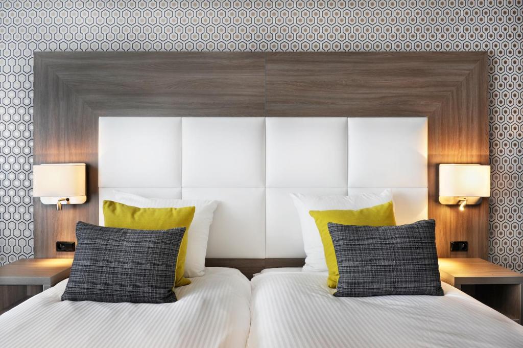Postel nebo postele na pokoji v ubytování Van der Valk Hotel Nazareth-Gent