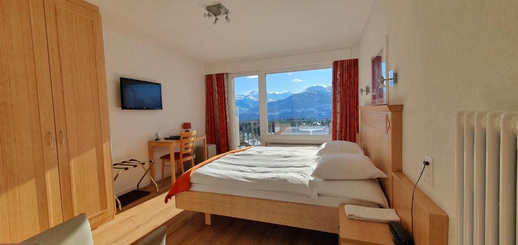Postel nebo postele na pokoji v ubytování Hôtel Splendide