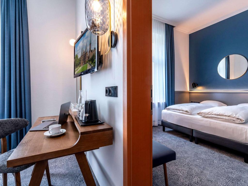 Postel nebo postele na pokoji v ubytování Mercure Hotel Luebeck City Center