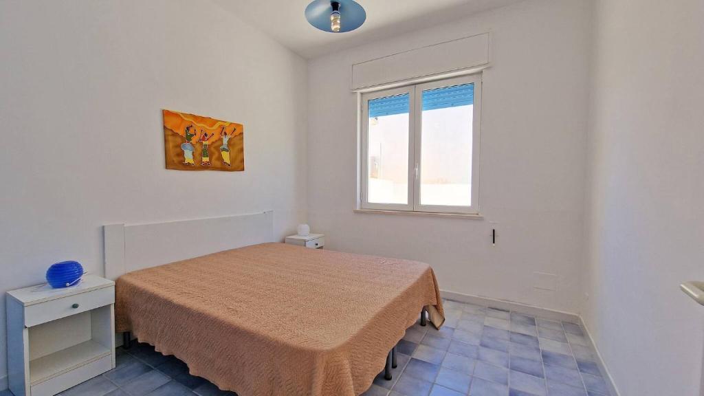 Postel nebo postele na pokoji v ubytování Residence La Corte by Salento Affitti