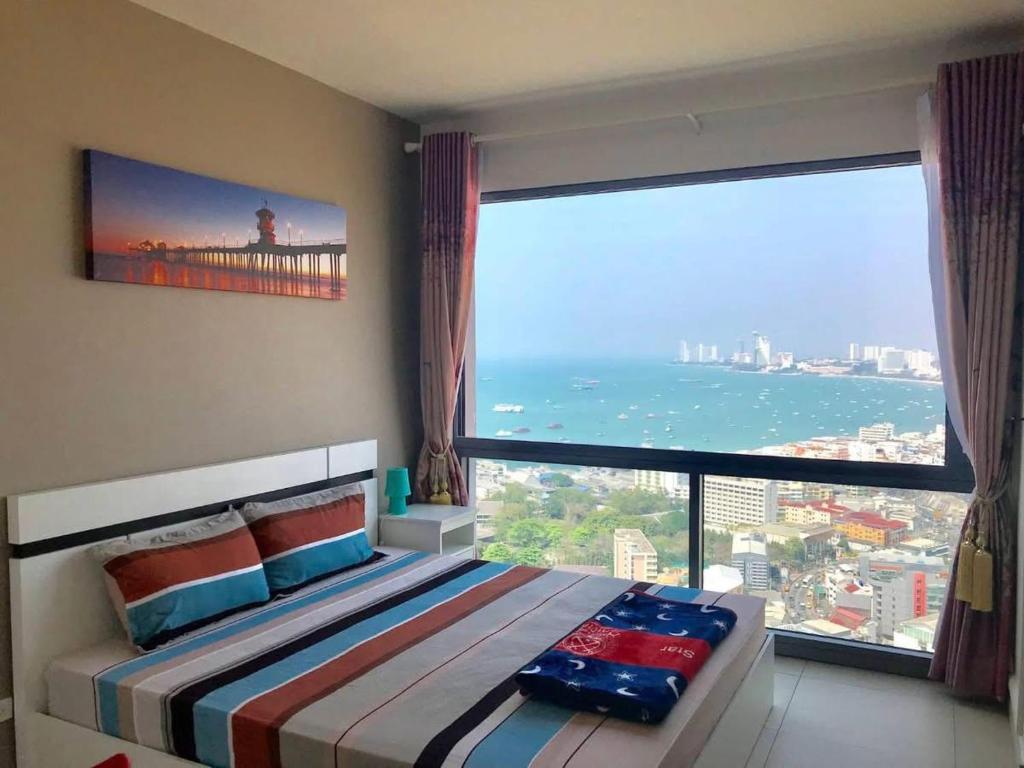 Llit o llits en una habitació de Unixx Pattaya High floor view