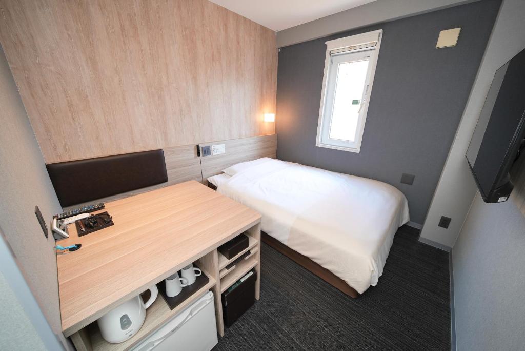 Postel nebo postele na pokoji v ubytování Super Hotel Hiroshima