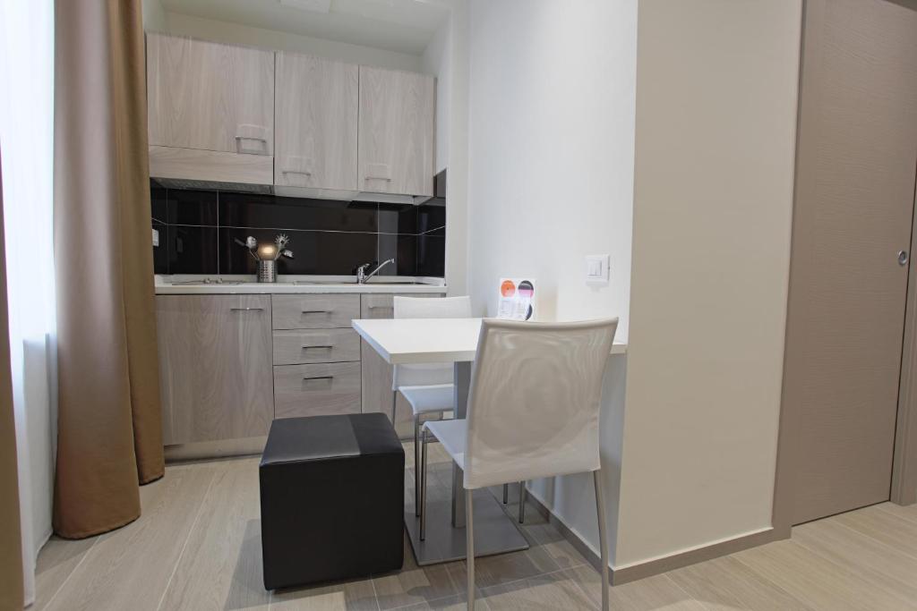 Kuchyň nebo kuchyňský kout v ubytování Hotel Agrigento Home