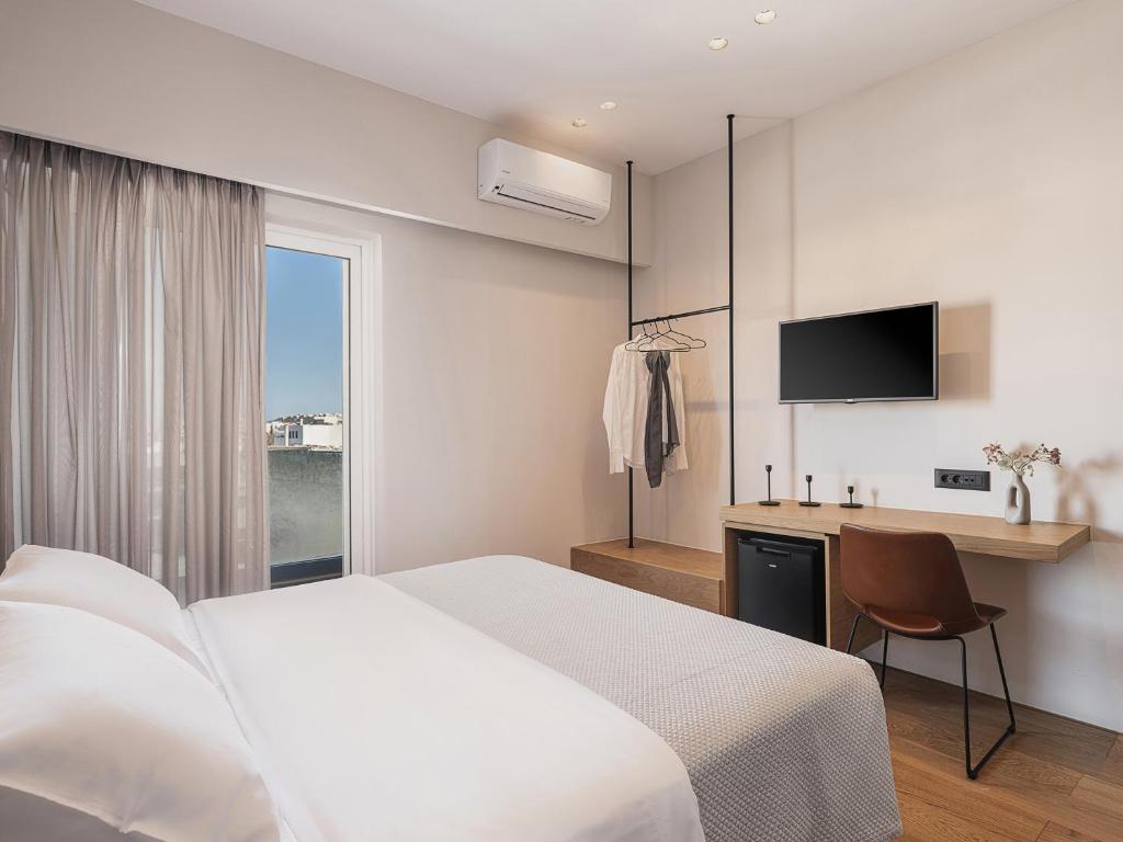 Postel nebo postele na pokoji v ubytování Theofilos City Hotel