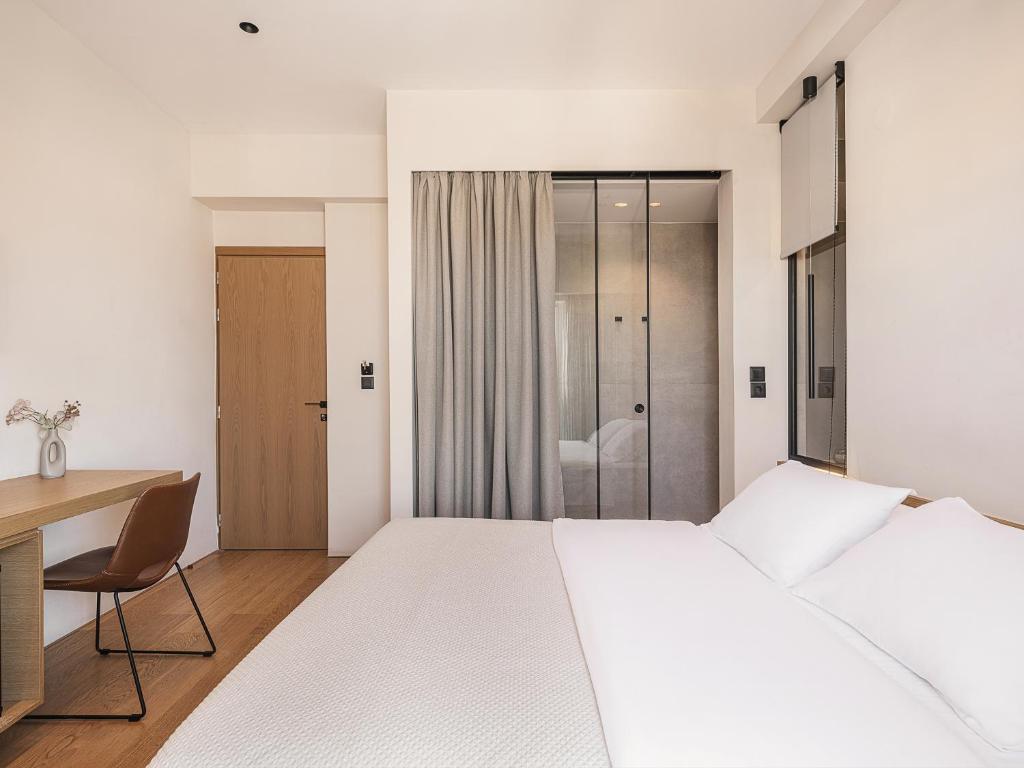 Postel nebo postele na pokoji v ubytování Theofilos City Hotel