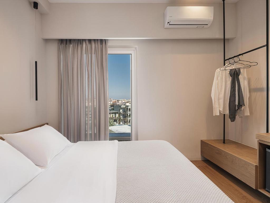 Postel nebo postele na pokoji v ubytování Theofilos City Hotel