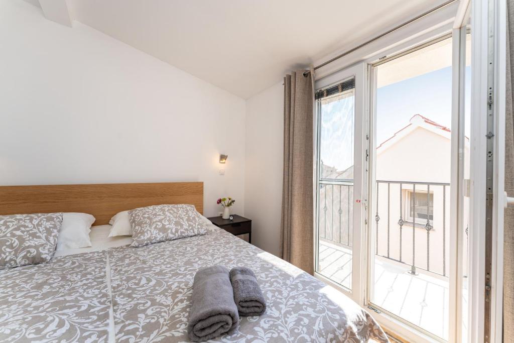 Posteľ alebo postele v izbe v ubytovaní ApartmentHouse Ivana