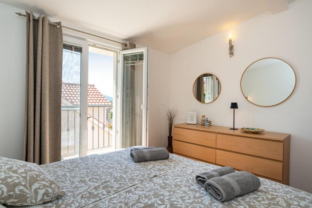 Posteľ alebo postele v izbe v ubytovaní ApartmentHouse Ivana