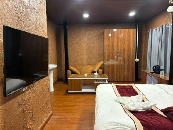 Letto o letti in una camera di Nirvana Resort