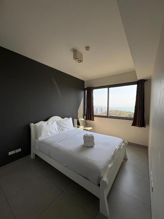 Llit o llits en una habitació de Unixx Pattaya High floor view
