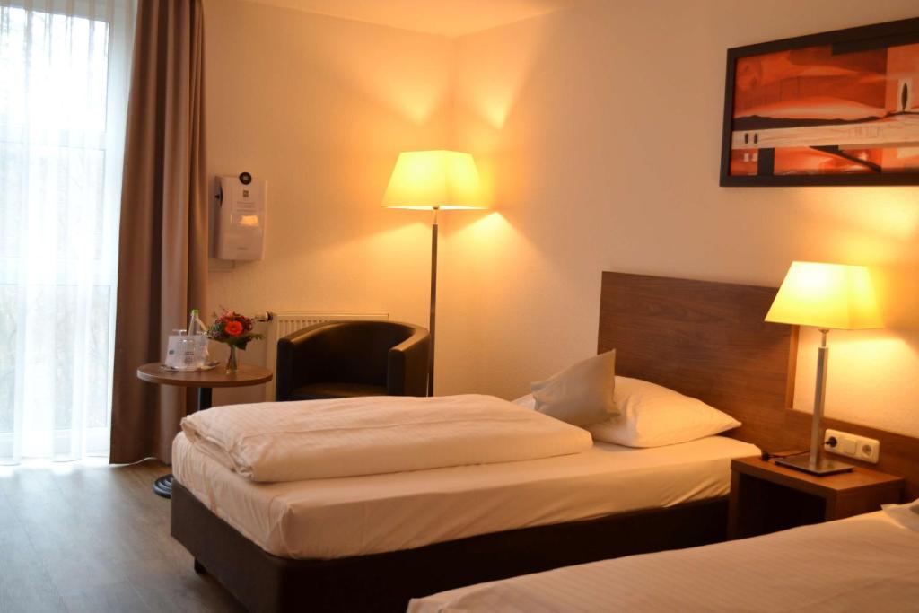 Postel nebo postele na pokoji v ubytování Best Western Hotel Erlangen