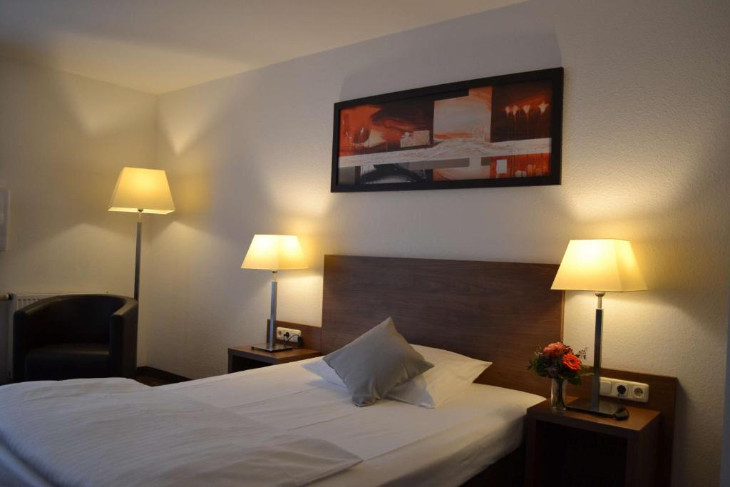 Postel nebo postele na pokoji v ubytování Best Western Hotel Erlangen