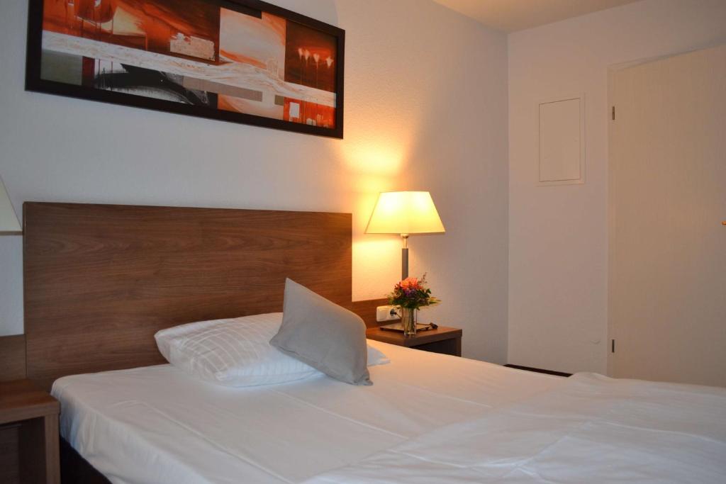 Postel nebo postele na pokoji v ubytování Best Western Hotel Erlangen