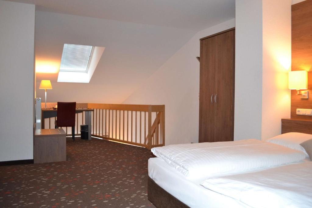 Postel nebo postele na pokoji v ubytování Best Western Hotel Erlangen