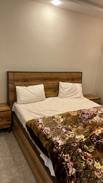 Postel nebo postele na pokoji v ubytování Farooq hotel