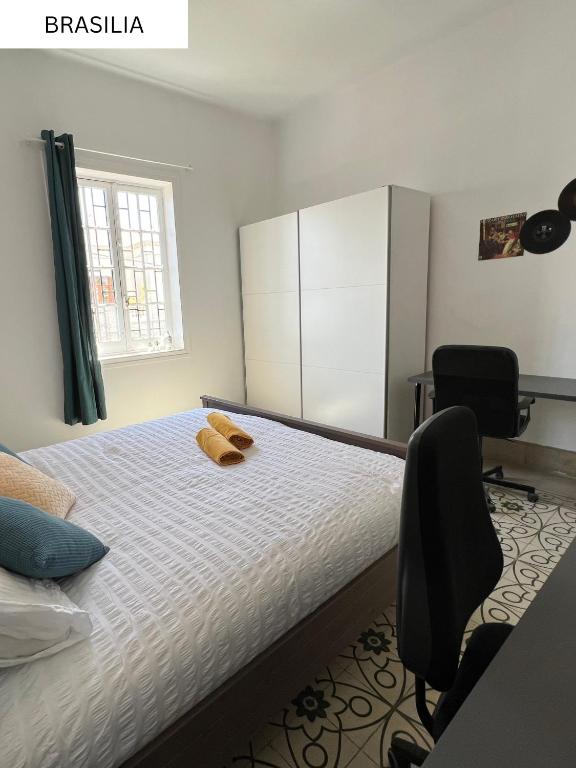 Postel nebo postele na pokoji v ubytování CoLiving Villa Brasil