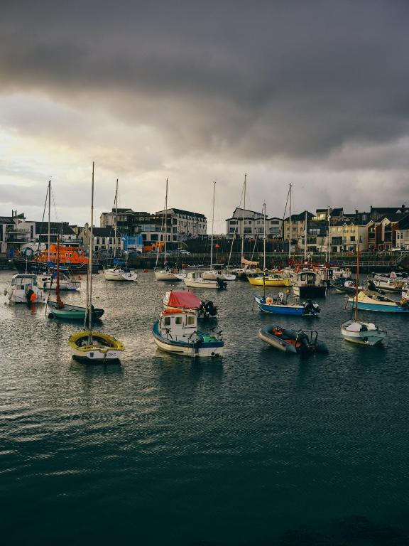 a group of boats in the water in a harbor at Portrush Adelphi in Portrush