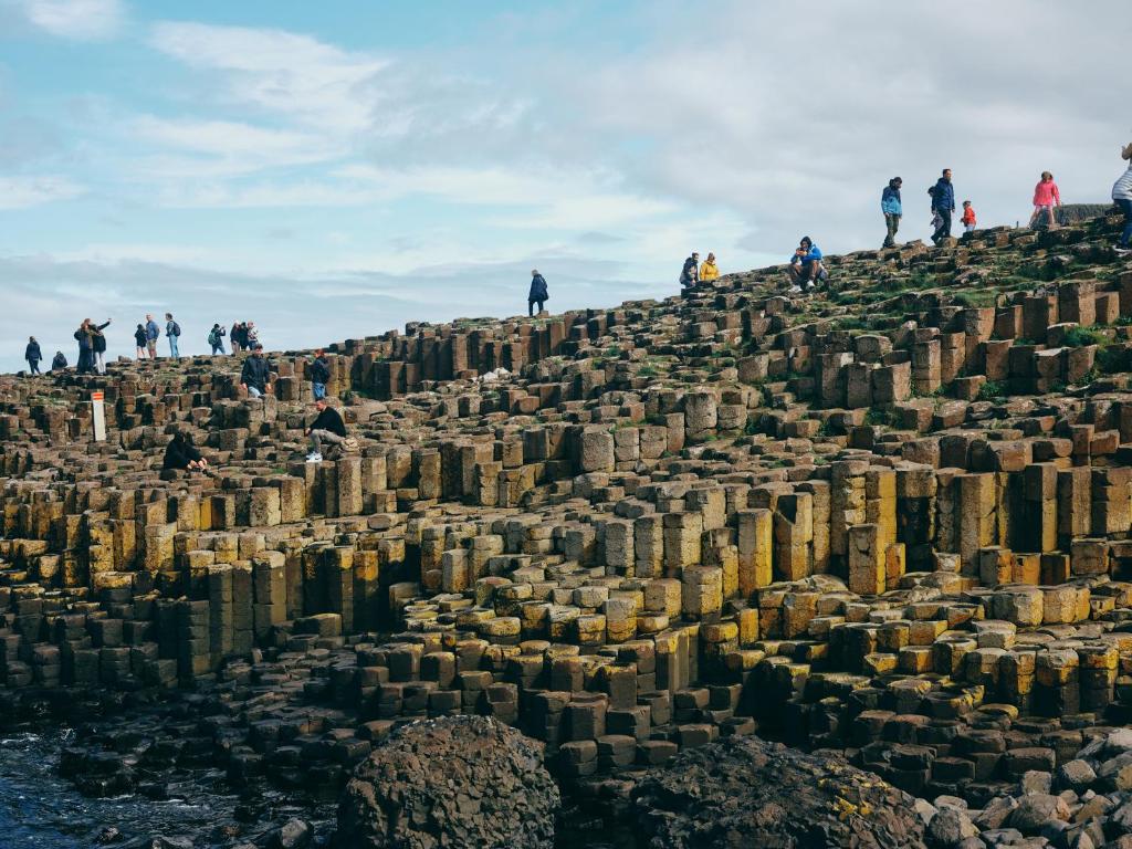 a group of people standing on top of a mountain at Portrush Adelphi in Portrush