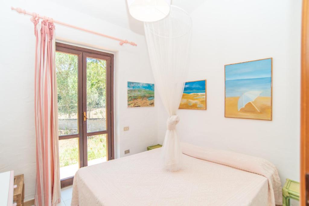A bed or beds in a room at Villa Calipso