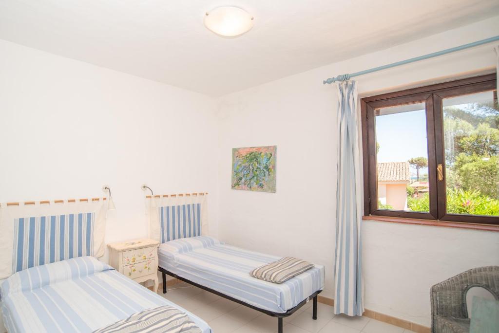 A bed or beds in a room at Villa Calipso