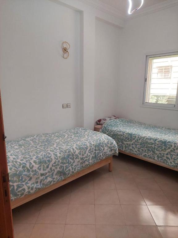 Postel nebo postele na pokoji v ubytování Hi Home