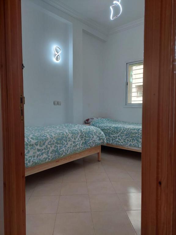 Postel nebo postele na pokoji v ubytování Hi Home