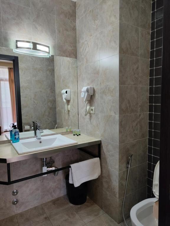 Koupelna v ubytování Sani Apart Hotel