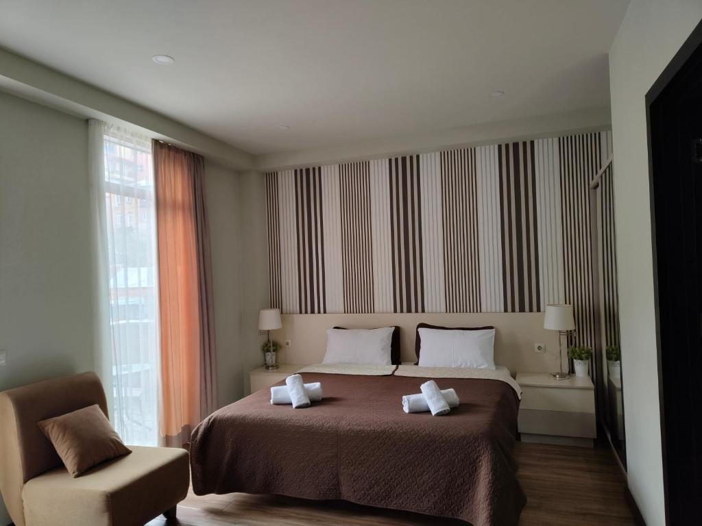 Postel nebo postele na pokoji v ubytování Sani Apart Hotel