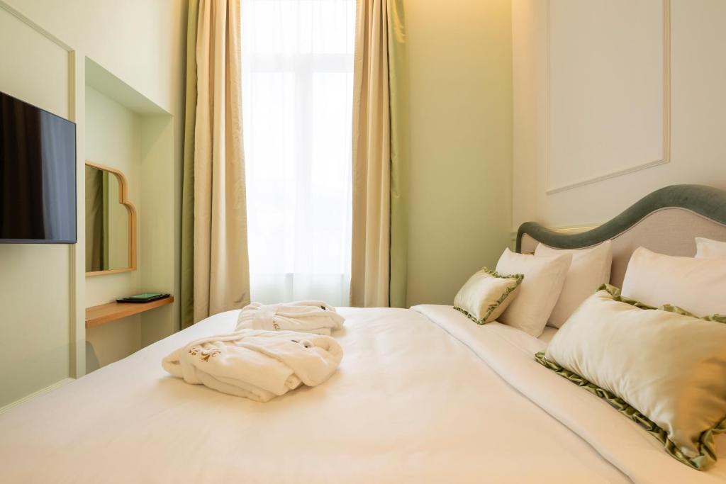 Postel nebo postele na pokoji v ubytování Les Bains de Spa