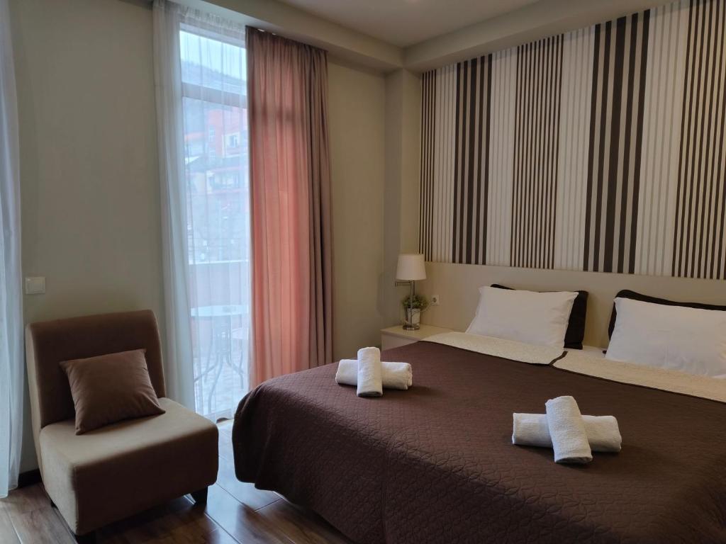 Postel nebo postele na pokoji v ubytování Sani Apart Hotel