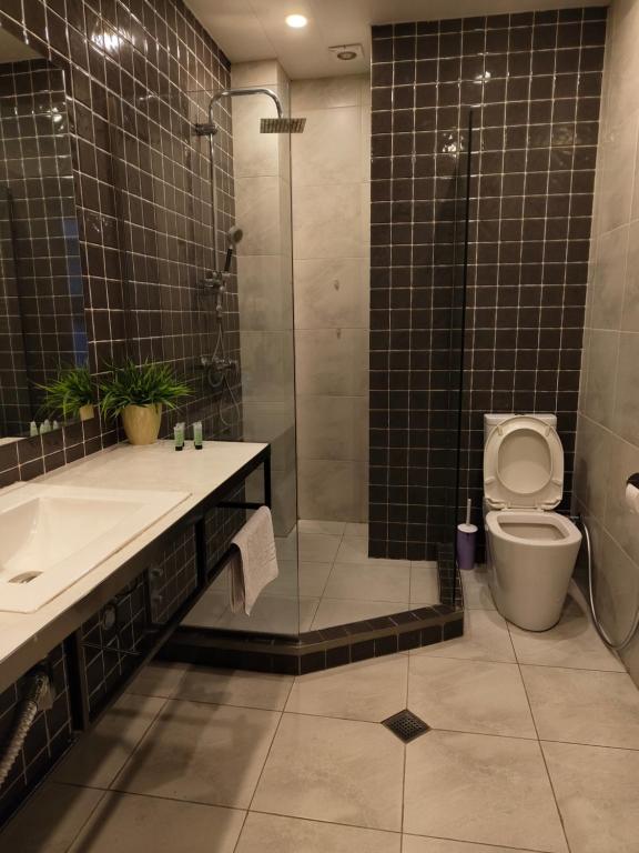 Koupelna v ubytování Sani Apart Hotel