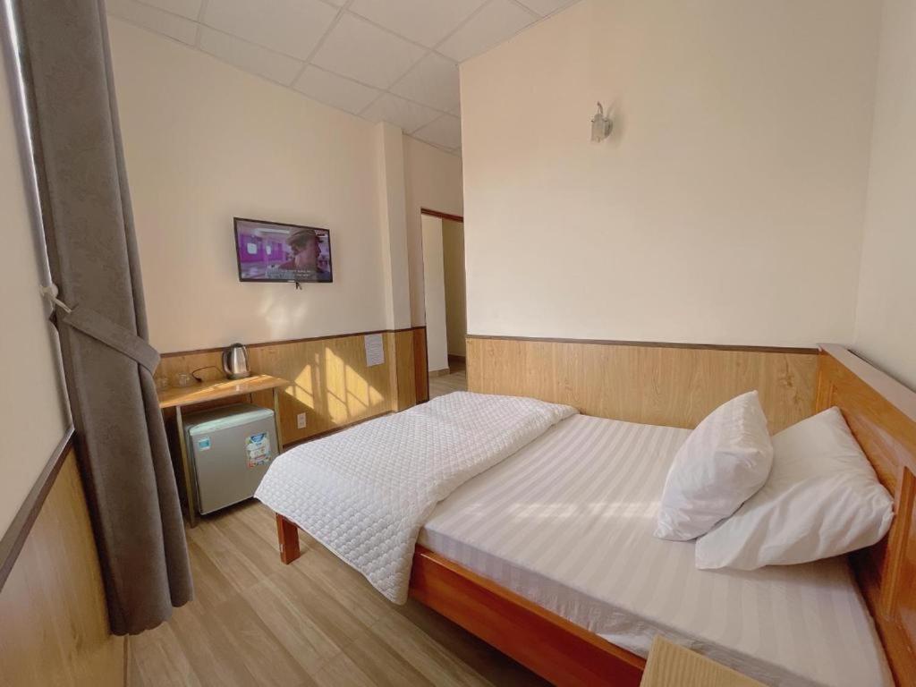 Postel nebo postele na pokoji v ubytování Cattleya