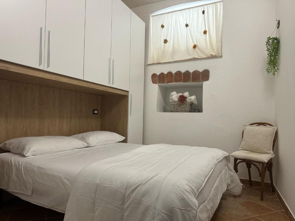 Postel nebo postele na pokoji v ubytování Locazione Turistica Sa Tùrre