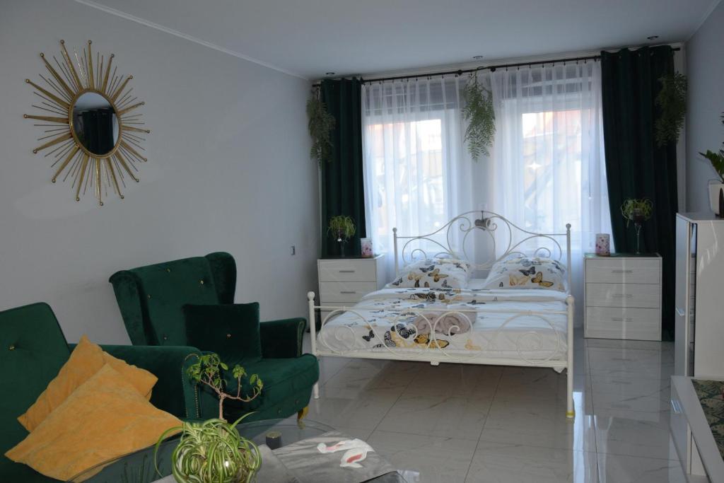 Ένα ή περισσότερα κρεβάτια σε δωμάτιο στο Apartament u Danusi