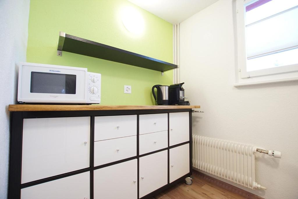 Kuchyň nebo kuchyňský kout v ubytování Apartment Heimathus