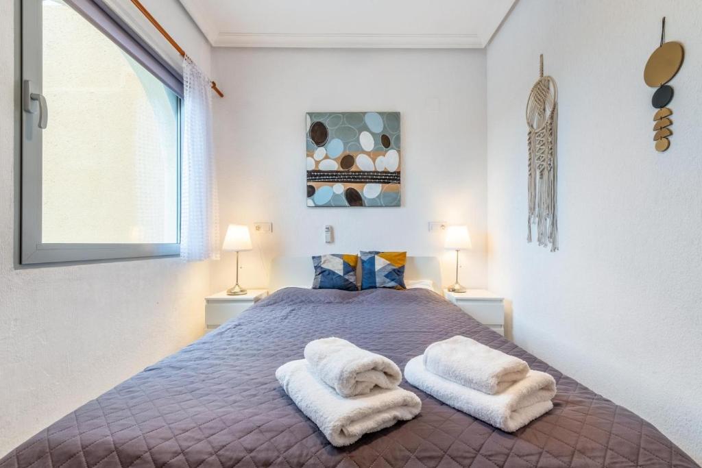 Postel nebo postele na pokoji v ubytování 059 Bungalow Torrelamata