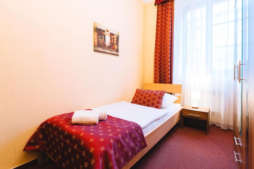 Postel nebo postele na pokoji v ubytování Elzet penzion